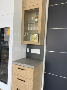 a wine shelf in a kitchen in a south florida home