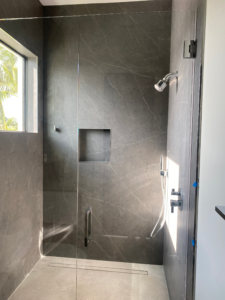 a glass enclosure of a shower