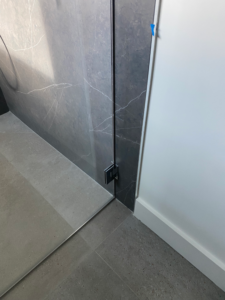 a glass enclosure of a shower