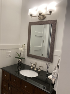 a mirror and sink in a boca raton bathroom