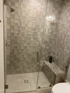 a modern shower with a glass enclosure in boca raton