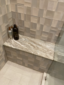 a bench within a glass enclosed shower in boca raton, florida